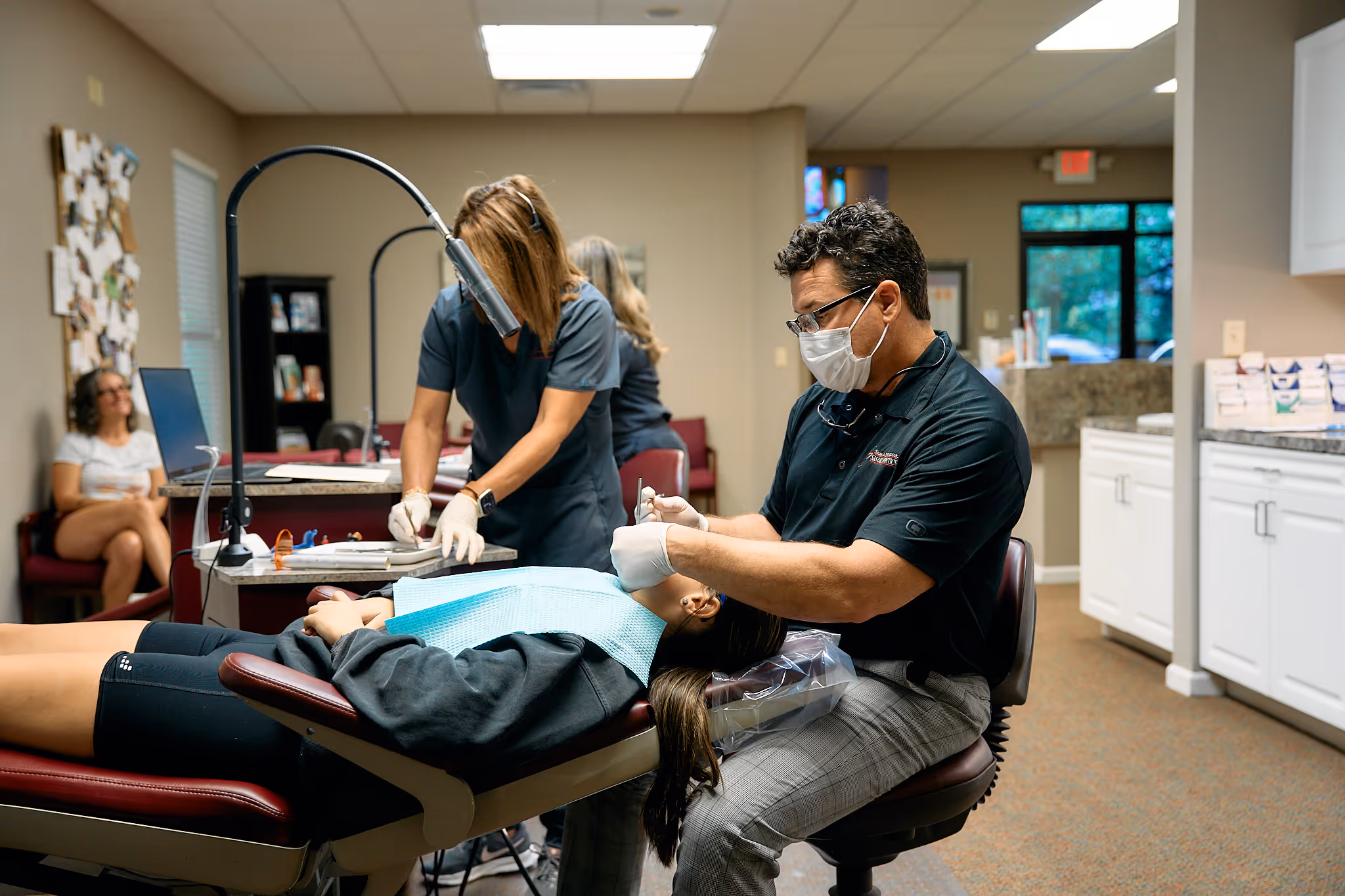 Dr. Smith working with patient